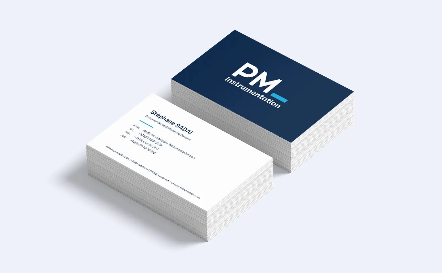 PM Instrumentation business cards with professional visual identity for measurement and industrial instrumentation solutions